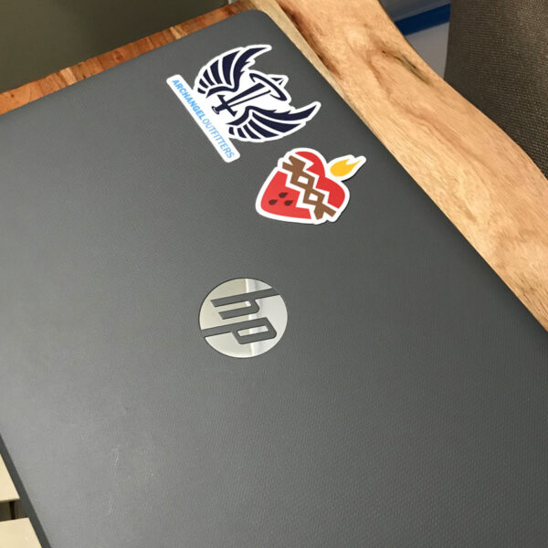 Sacred Heart of Jesus sticker on laptop